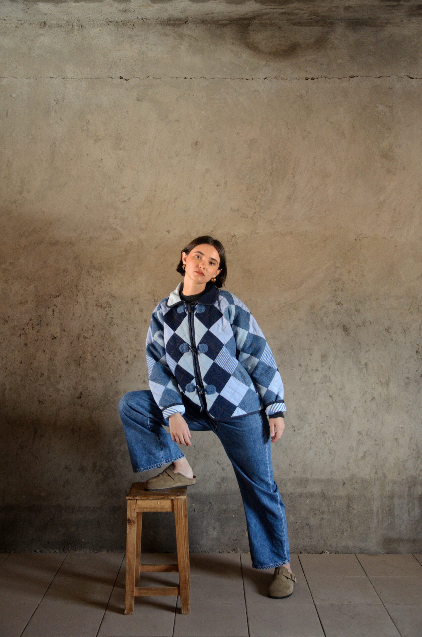 Antsa coat in blue quilted denim worn in a full silhouette