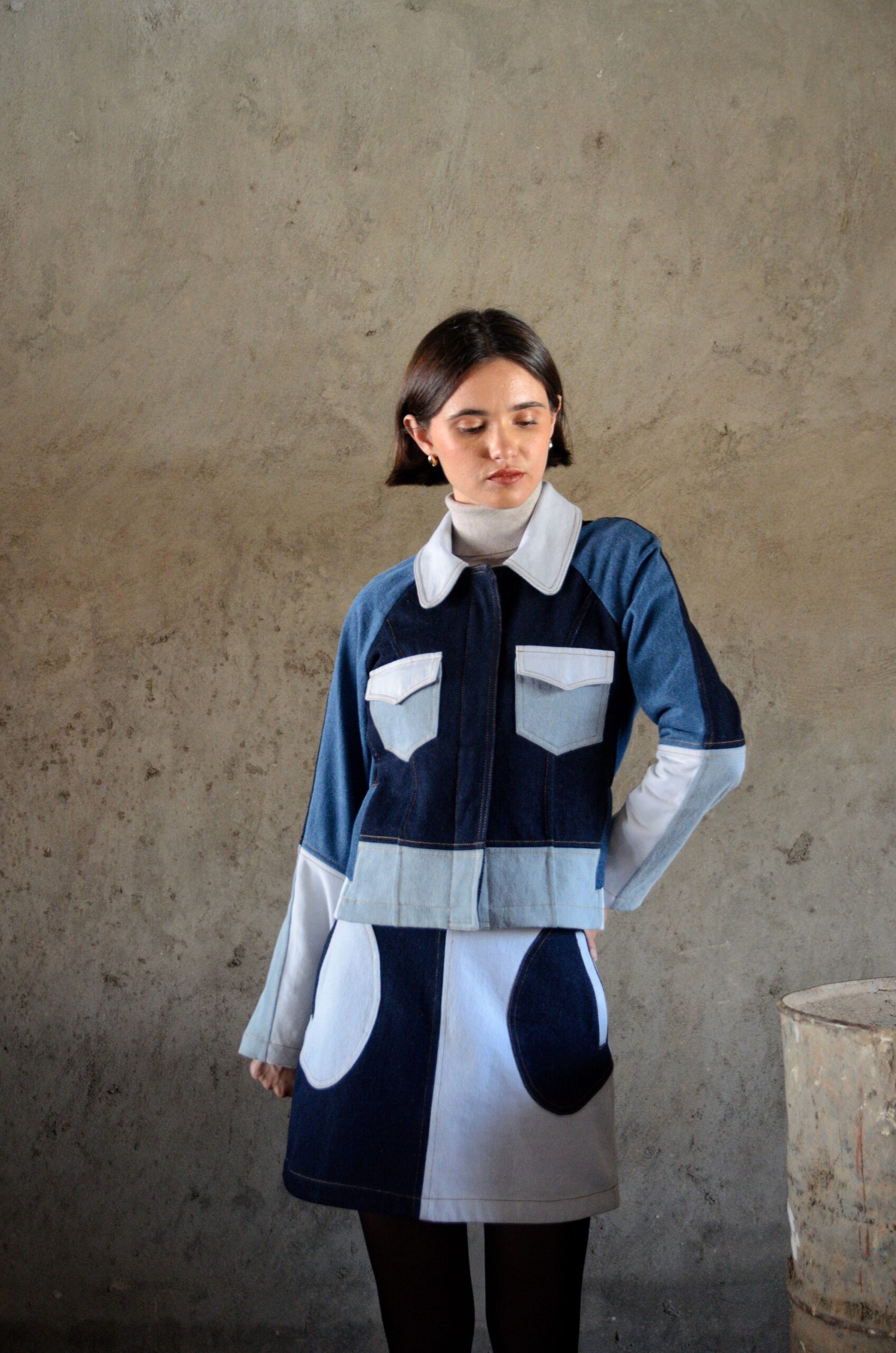 Doria jacket in blue patchwork denim front view with contrast paneling