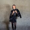Tantely skirt in black denim worn in a full silhouette with contrast stitching and crochet details